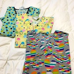 3 XL scrub tops with 2 front pockets each